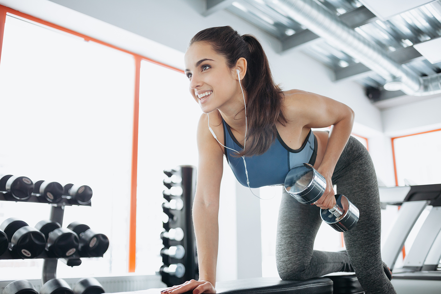 Happy woman doing an exercise